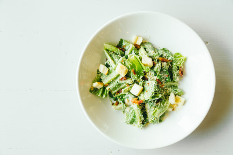Grilled caesar salad with fresh vegetable in white plate - Healthy food style